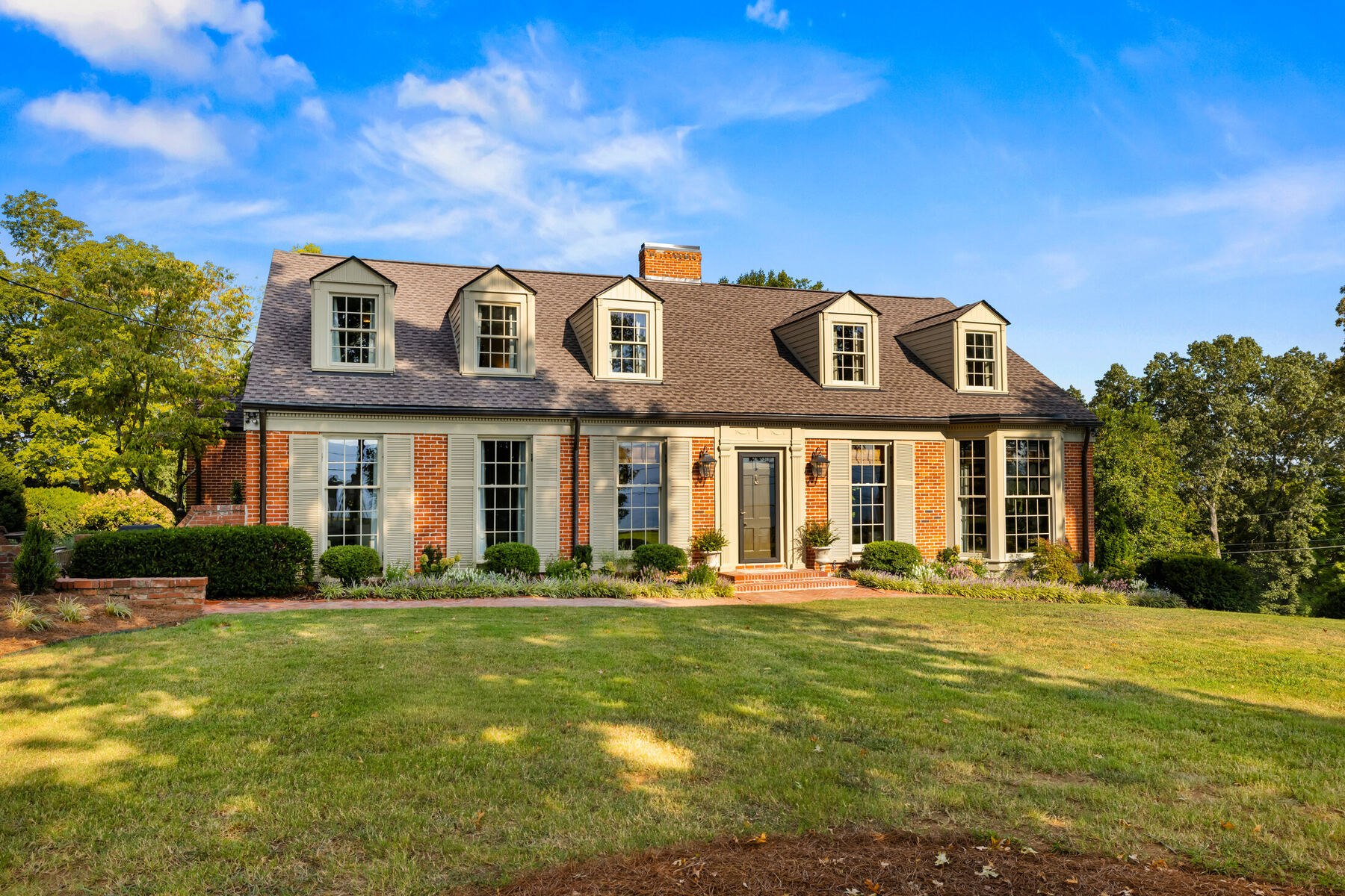 The symmetrical brick façade of Oak Cliff Manor