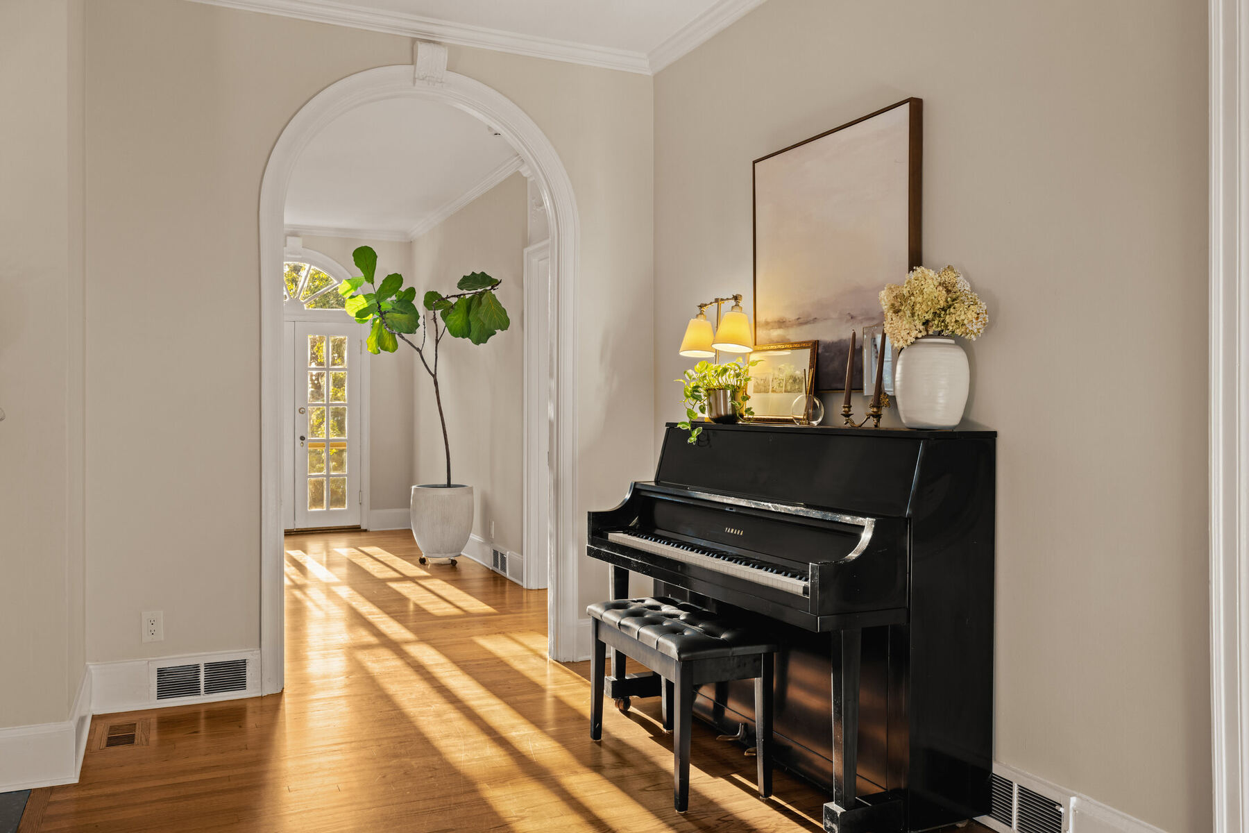 Piano beside an arched doorway